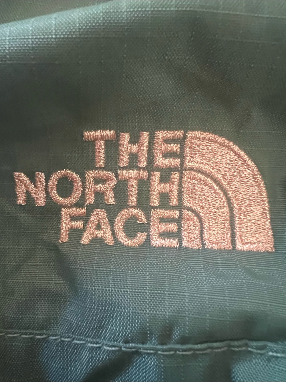 The North Face Backpack – Black with Pink Logo